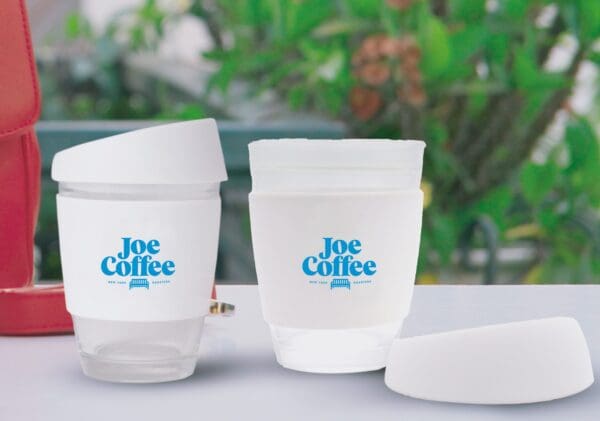 Glass Coffee Cup with a secure pushon Silicon lid and a wide heat resistant silicon band